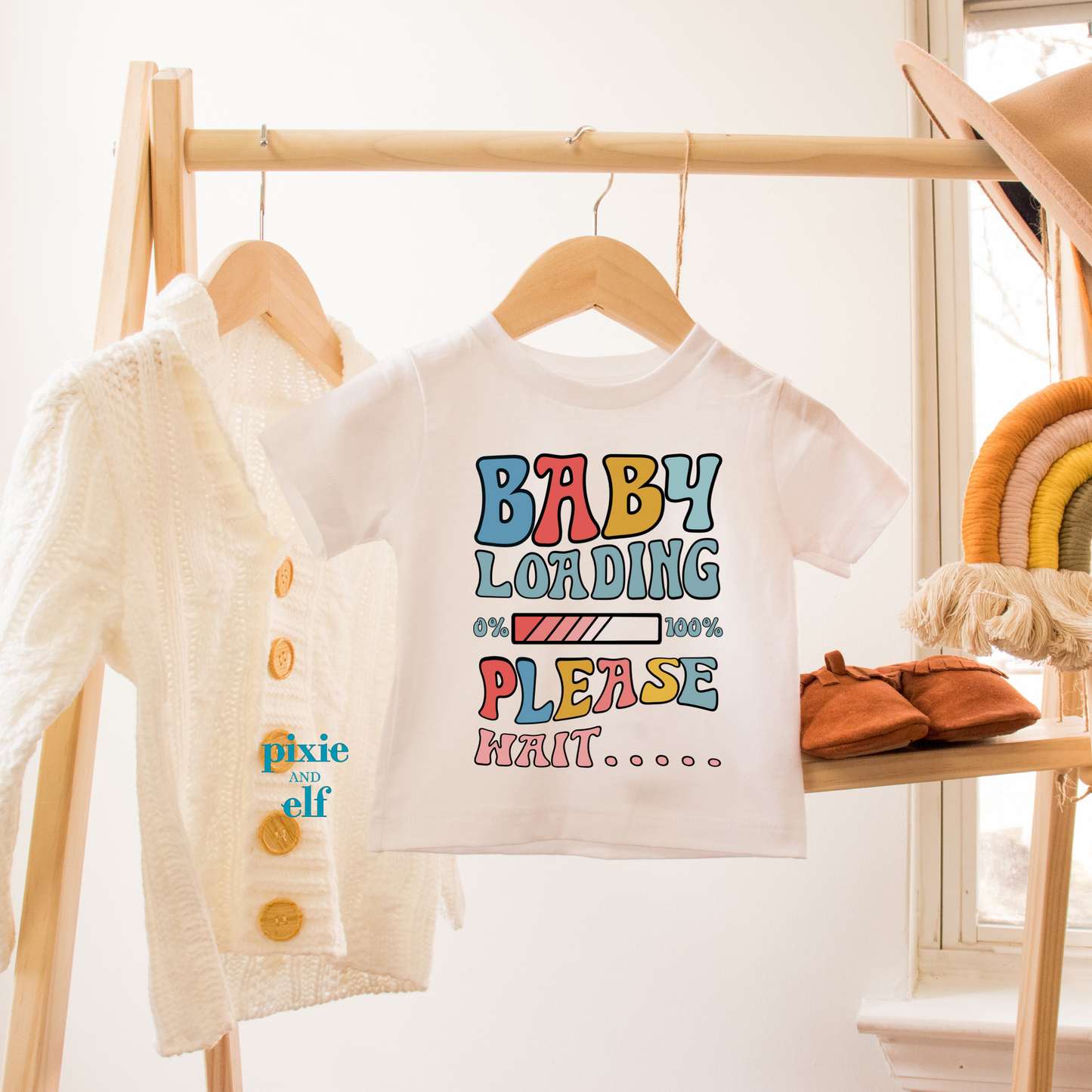 White t shirt with text baby loading please wait