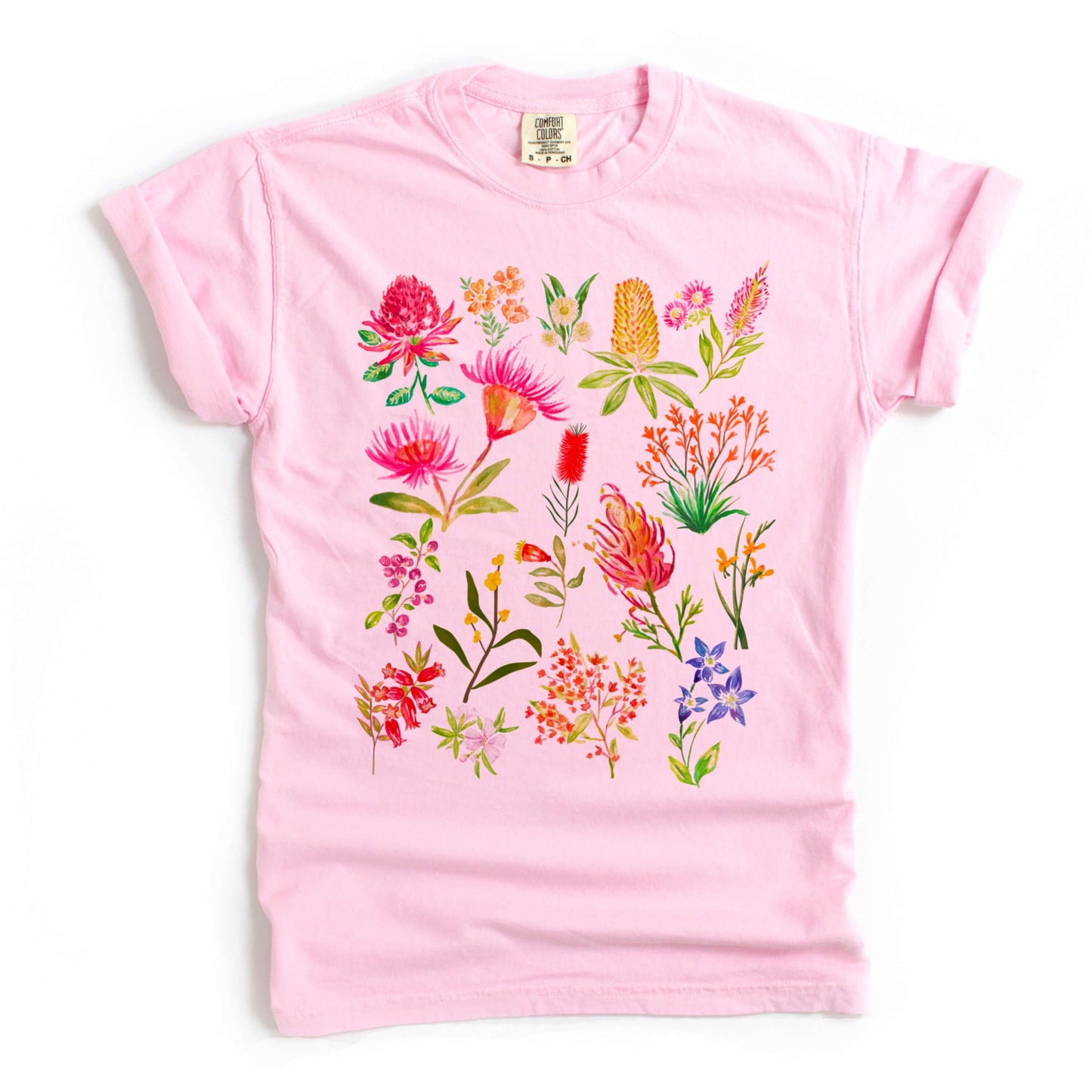 Colourful Australian flower graphic printed on a pink blossom Comfort Colors shirt