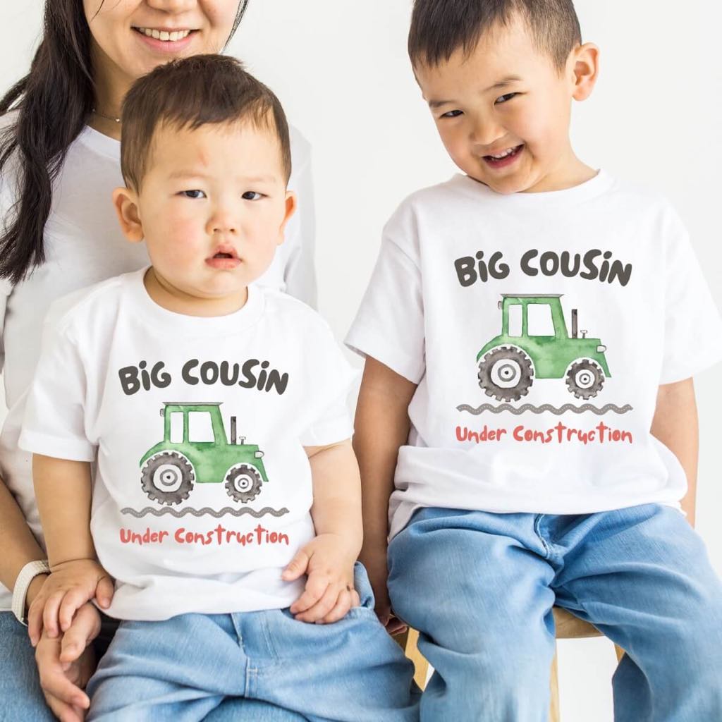 Big Cousin Under Construction with Green Truck on a Natural T-shirt