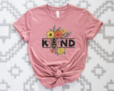 Pink t-shirt with a bee and floral design on a patterned background