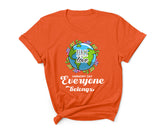 Orange t-shirt with a graphic design featuring a globe and text on a white background