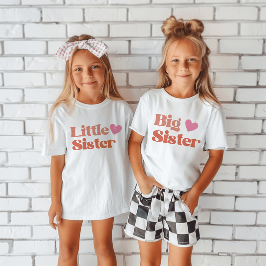 girls weaaring little sister and big sister t-shirts