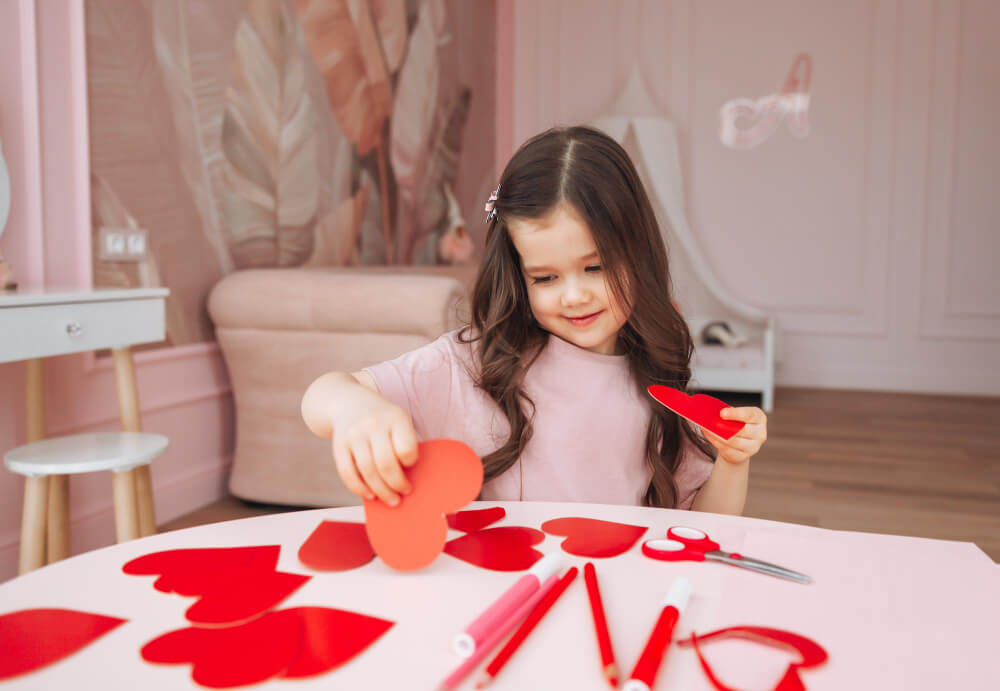 a child making Valentine's day crafts