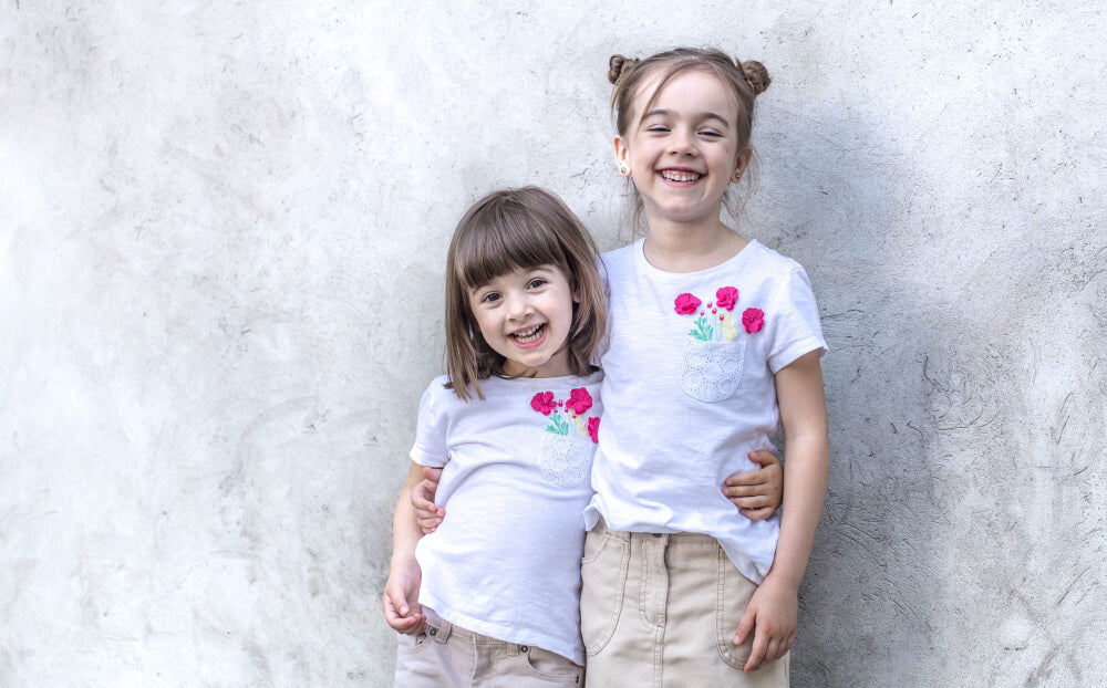 big sister and little sister with matching outfits