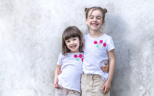 big sister and little sister with matching outfits