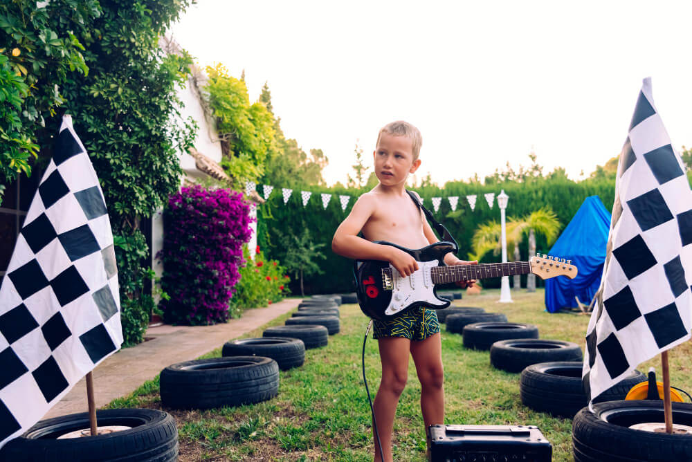 boy having a race car themed birthday party