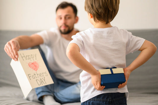 boy with a father's day gift for his father
