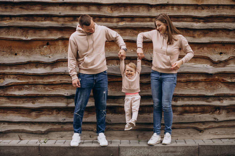 family wearing matching hoodies