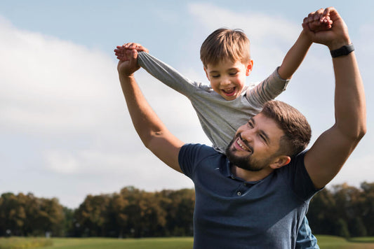 father and son enjoying a day in the park