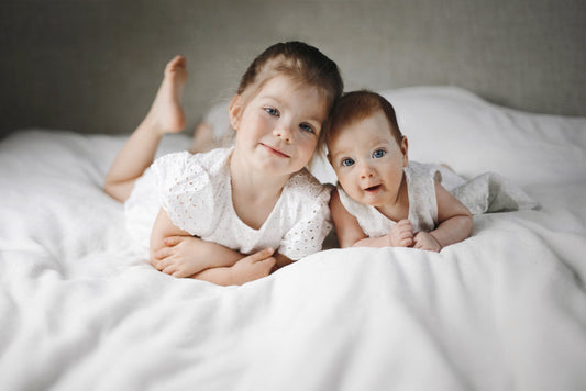 sibling bonding activities – toddler and baby spending quiet time together