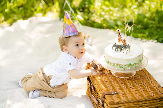 toddler celebrating first birthday outdoors