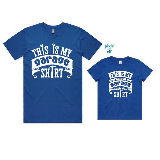 A blue t-shirt for an adult with the text 'This is my garage shirt' and a matching smaller t-shirt for a child with the same text.