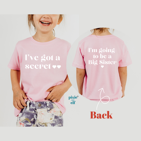 I’ve got a secret, I’m going to be a big sister in pink shirt