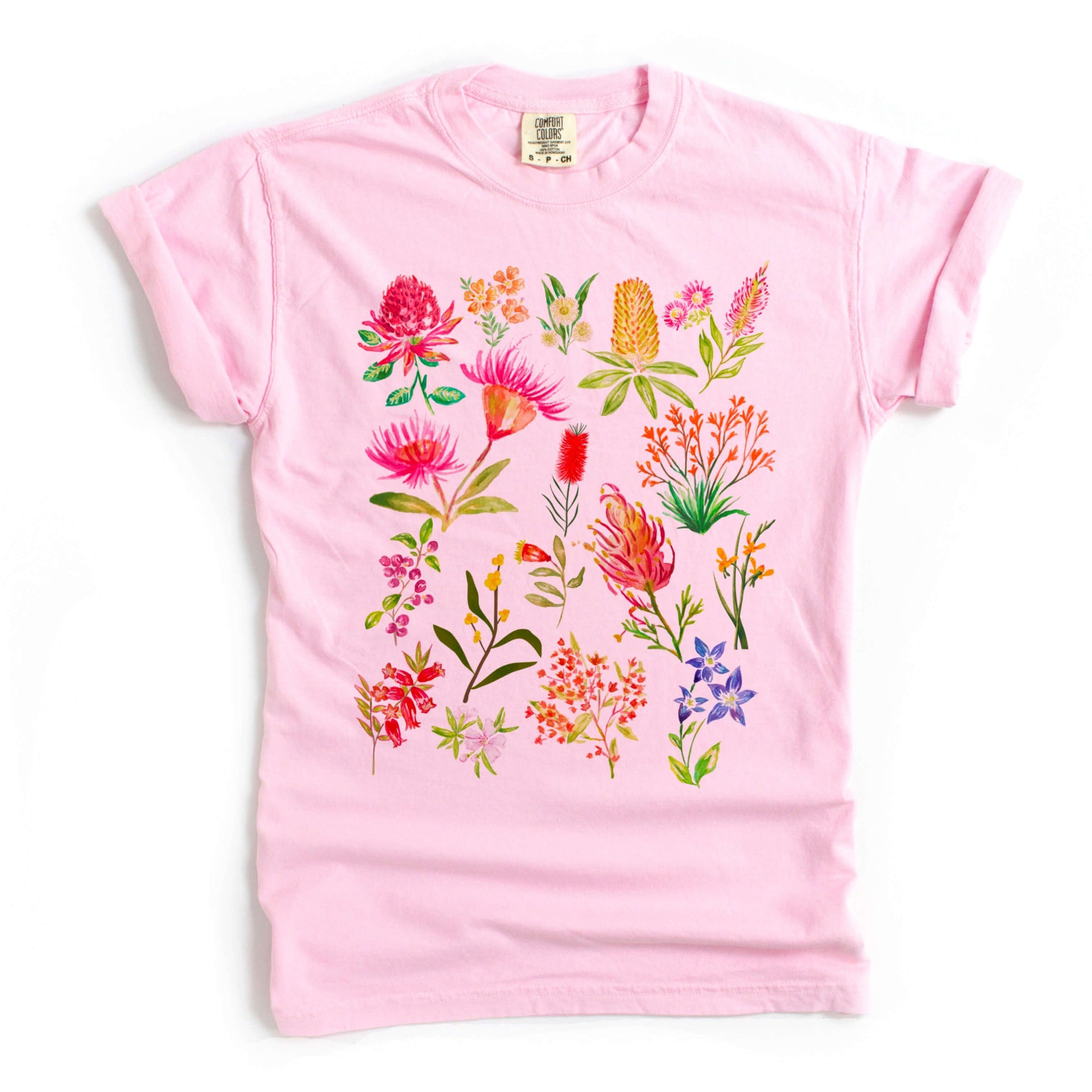 Colourful Australian flower graphic printed on a pink blossom Comfort Colors shirt