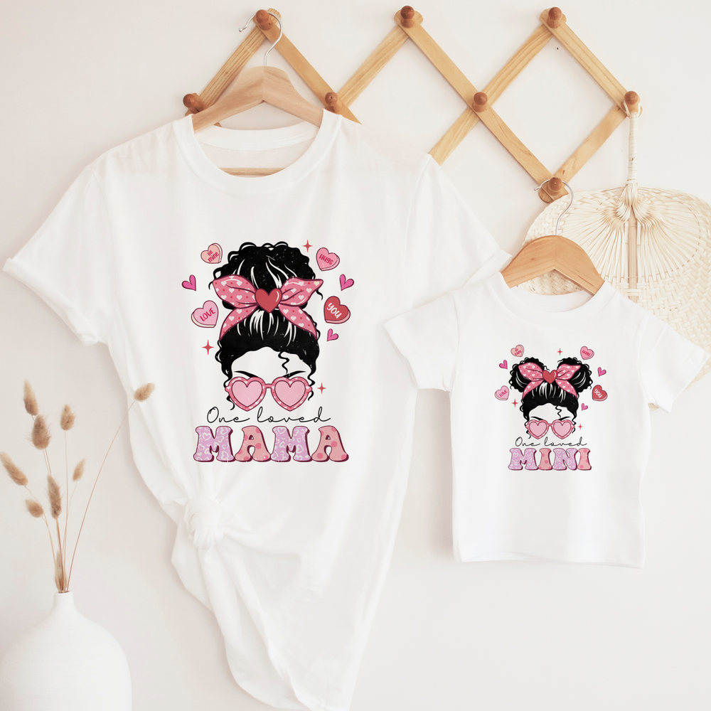One loved mama and mini with a hair bun and glasses design on white t shirts.