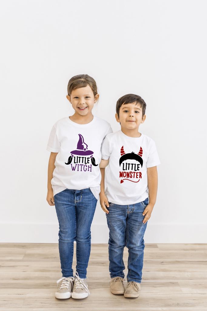 Brother and sister wearing the Little Witch and Little Monster shirts