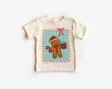Children's t-shirt with a gingerbread man design on a white background