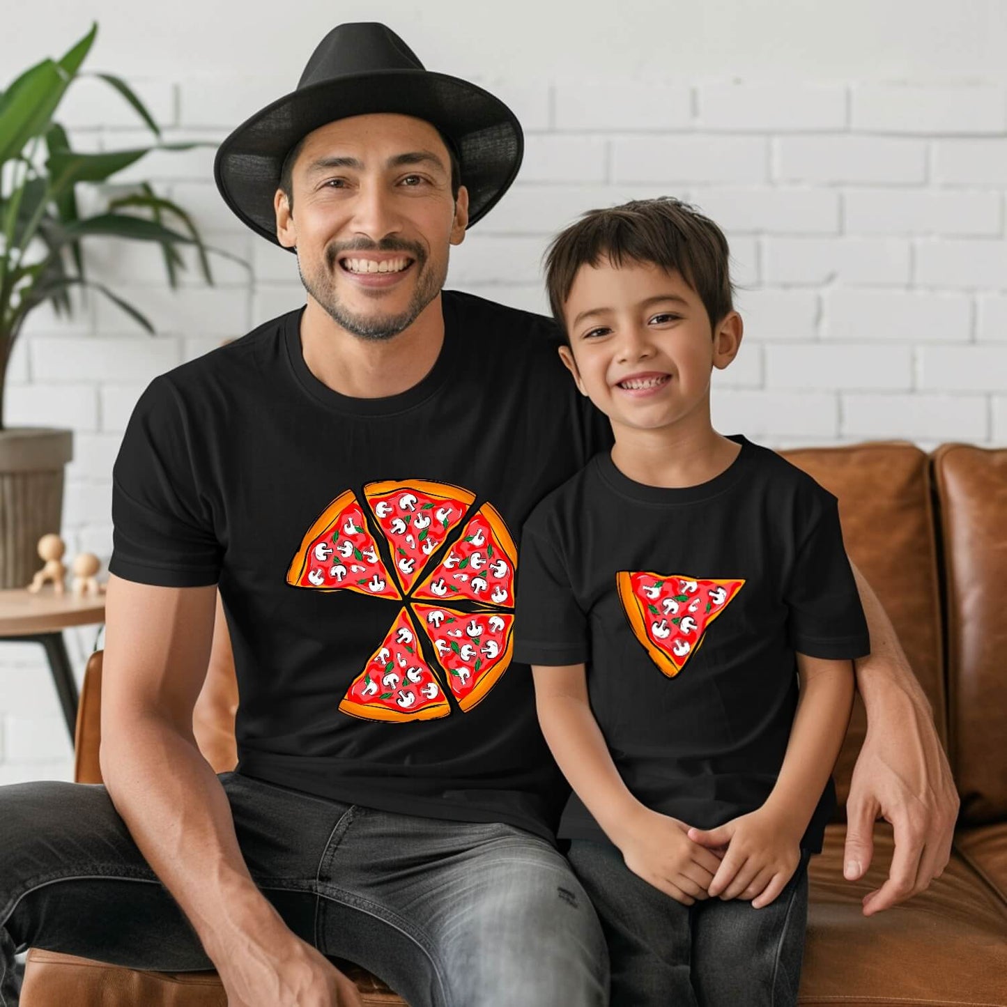 Father and son wearing matching pizza shirts