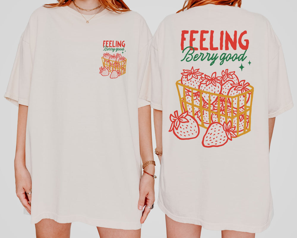 Back and front of the shirt with a basket of strawberries and a text " Feeling Berry Good