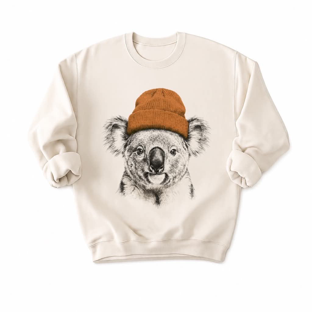 Beige Sweatshirt with a koala wearing a mustard beanie on a white background