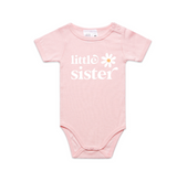Pink baby onesie with 'little sister' text and a daisy graphic on a white background