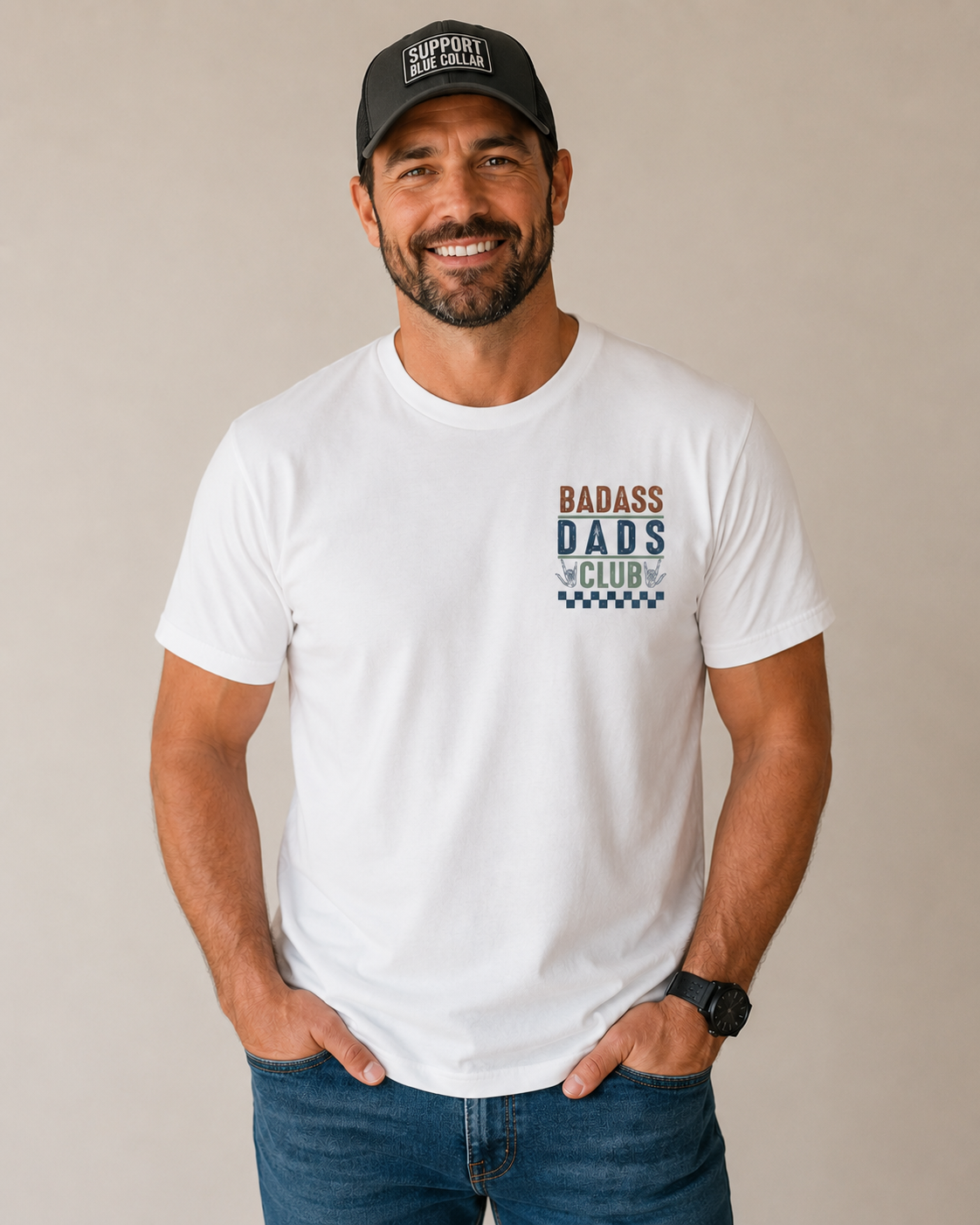 Man wearing a white t-shirt with 'Badass Dads Club' text and a black cap on a beige background