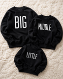 black jumper with big, middle and little print