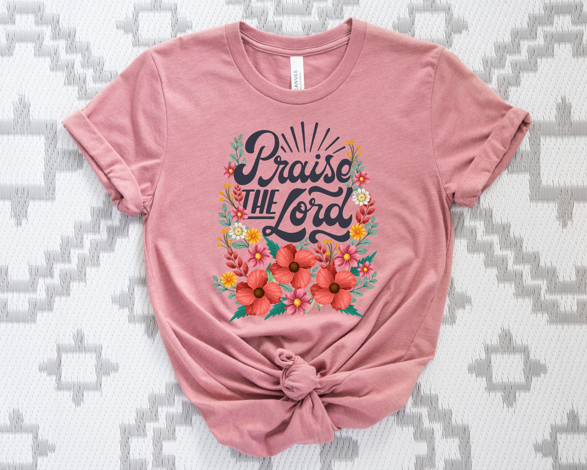 Faded rose  t-shirt with 'Praise the Lord' text and floral design on a patterned background