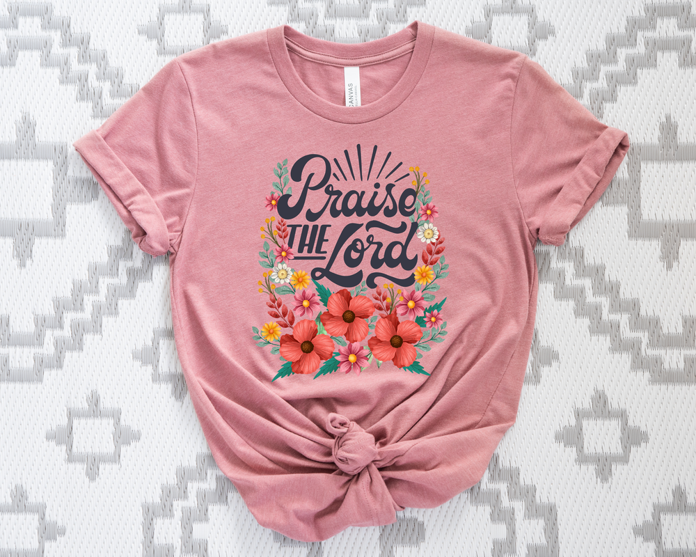 Faded rose  t-shirt with 'Praise the Lord' text and floral design on a patterned background