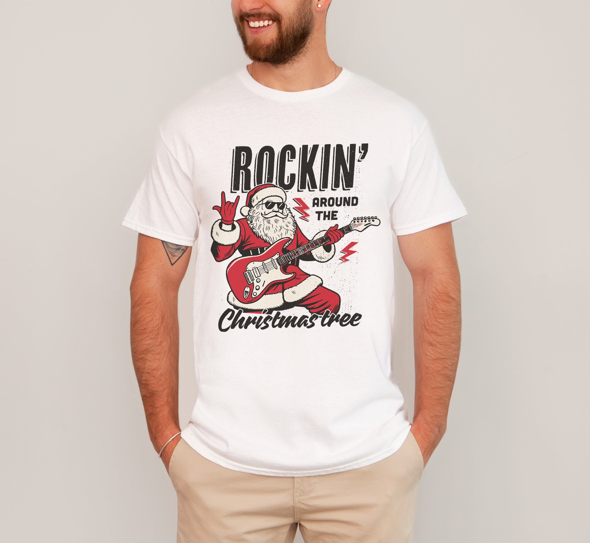 Man wearing Santa rockin around the christmas tree shirt in white