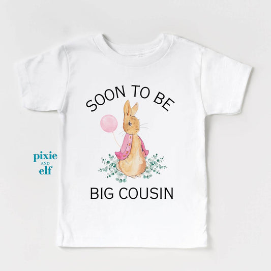 Soon to be big cousin pink bunny rabbit with balloon in white shirt