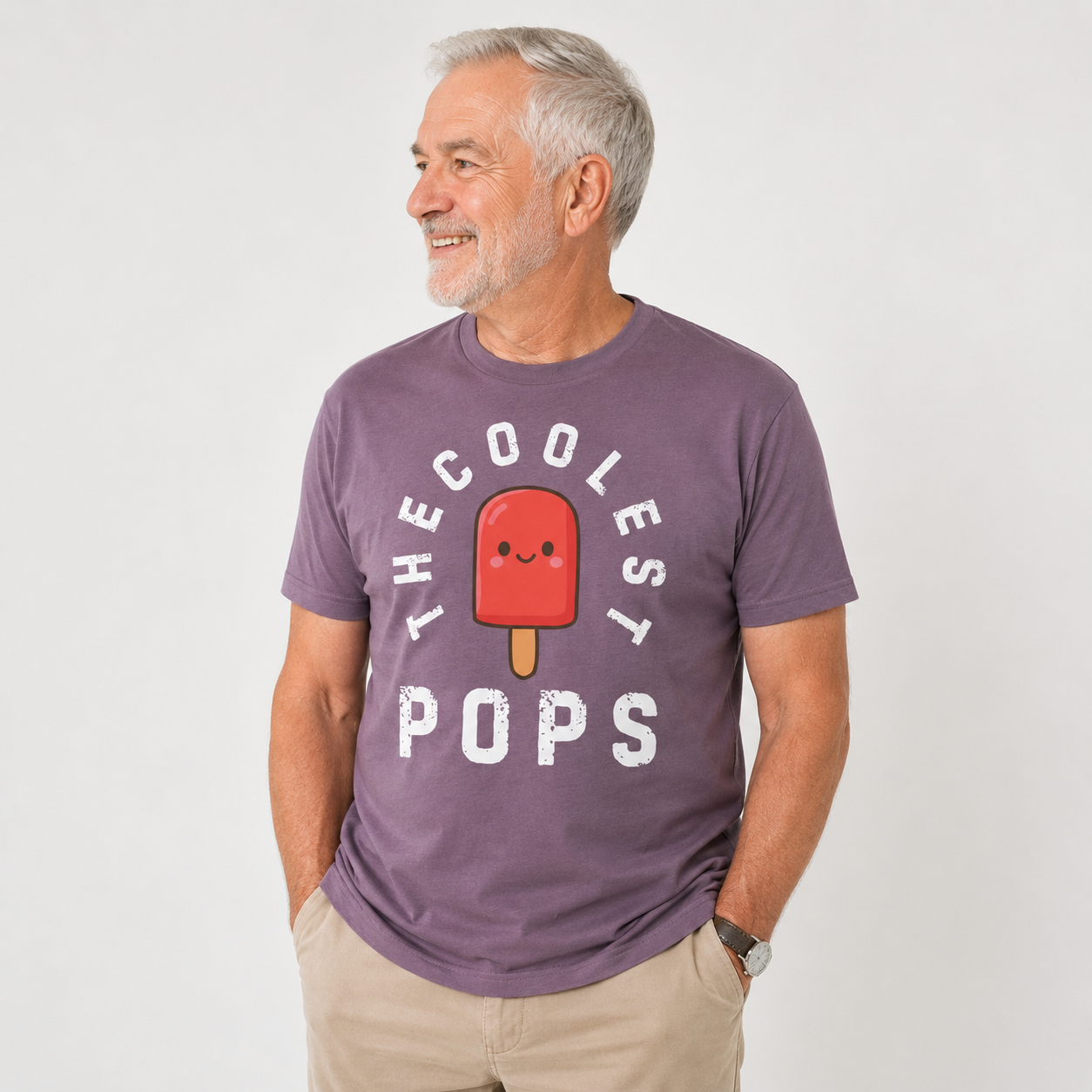 Man wearing a purple t-shirt with 'The Coolest Pops' graphic on a white background